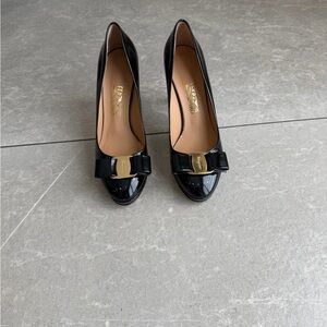 Salvatore Ferragamo Black Patent Leather Vara Bow Pumps with Gold Accent